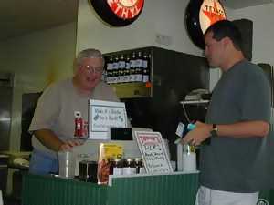 Filling Station owner Larry Bender said he was smiling because he remembered the GAS Web site fondly. We think he was smiling because our party of five dropped nearly $100 on barbecue.